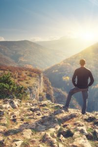 Man in mountain and sun shine Man in mountain and sun shine